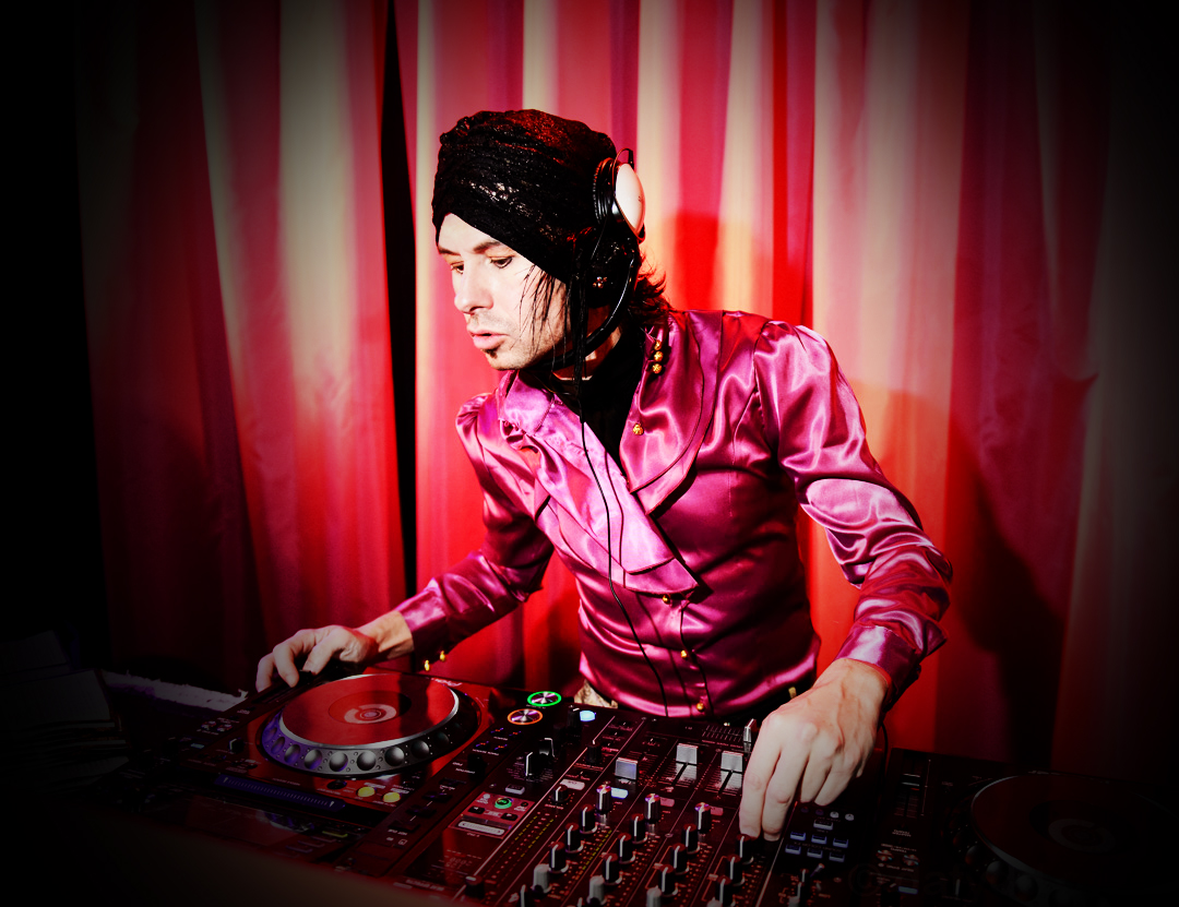 man in silk jacket and hat spinning decks at soho Thirteen LDN Chateau Denmark