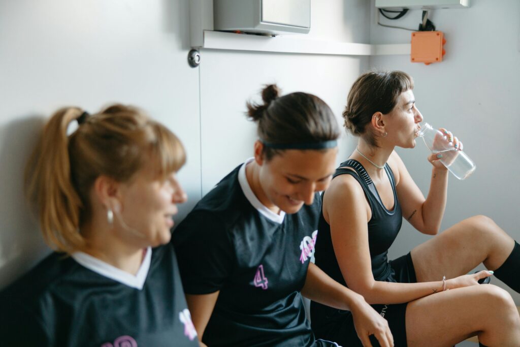 Women in a sports team in changing rooms