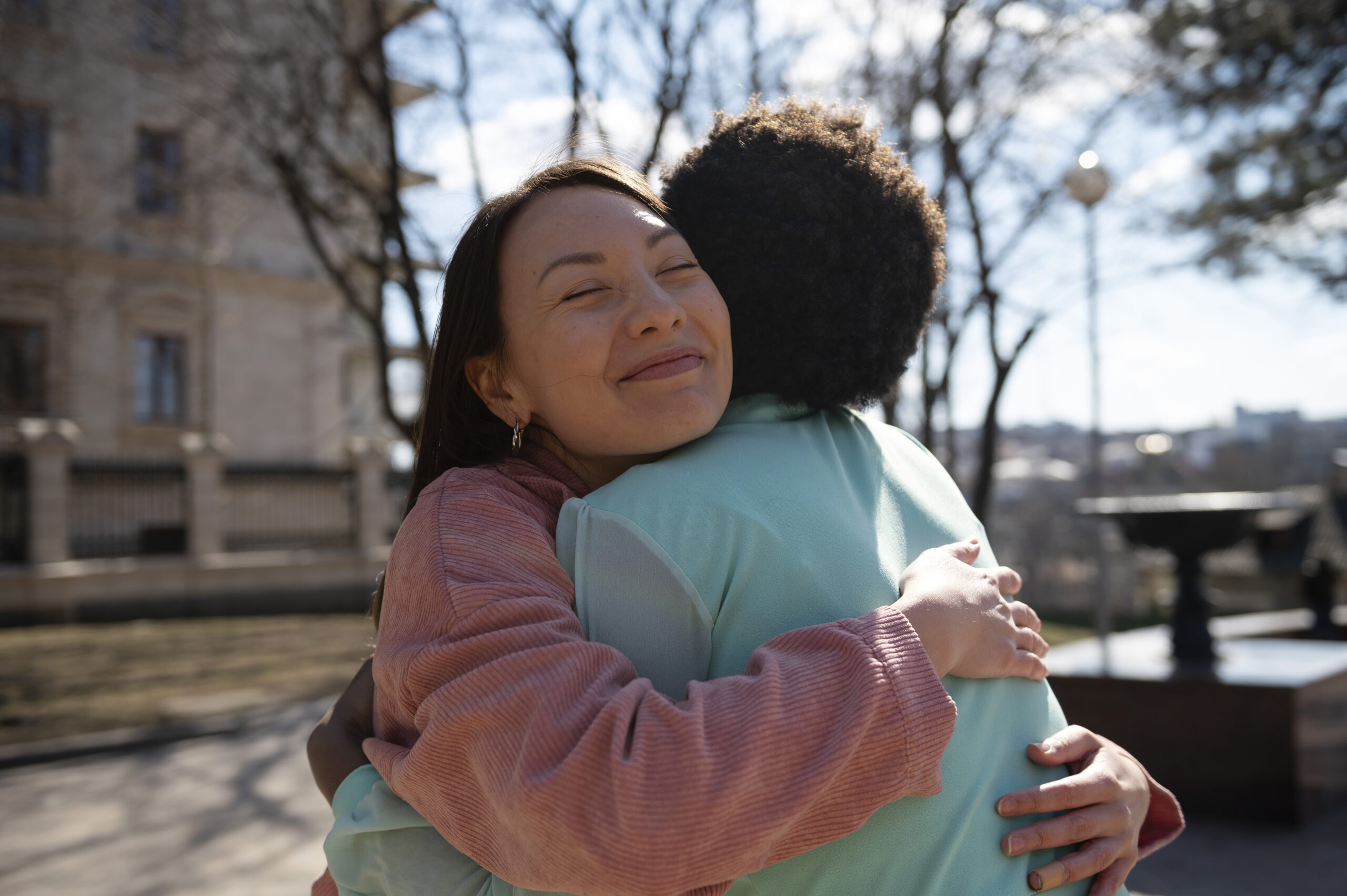 Middle aged women hugging