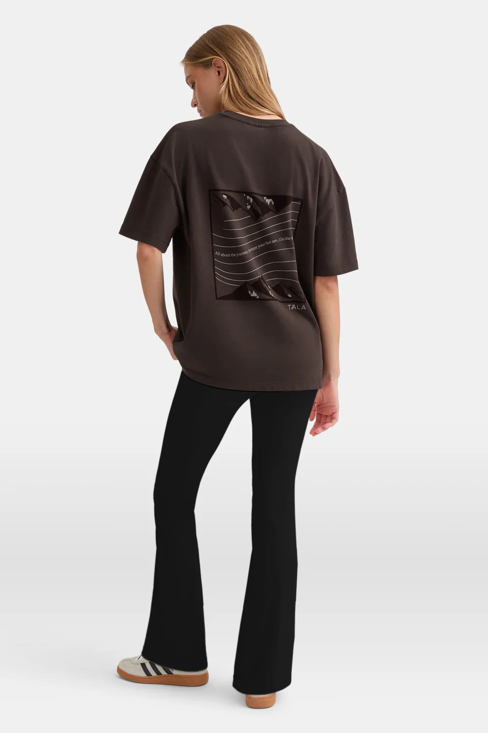 women wearing Tala t shirt turned around