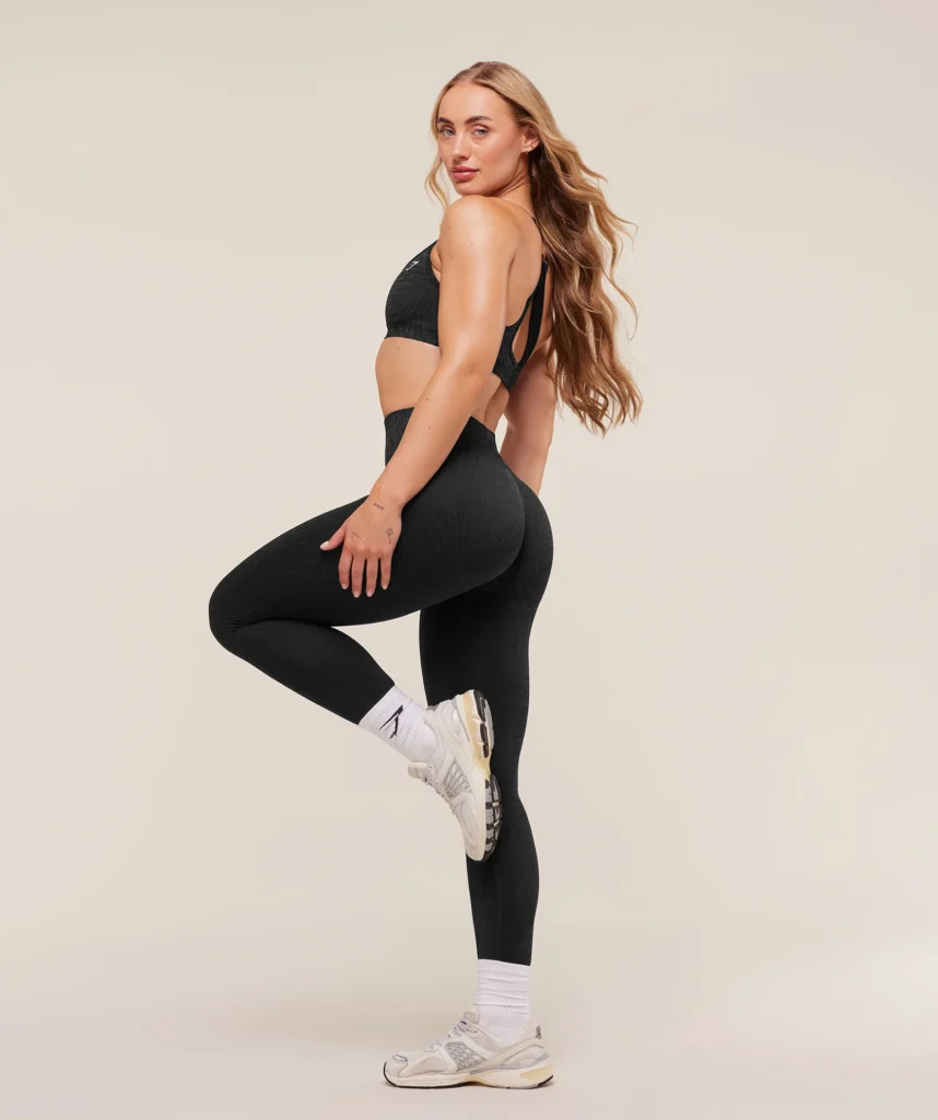 girl in Gymshark leggings with leg up