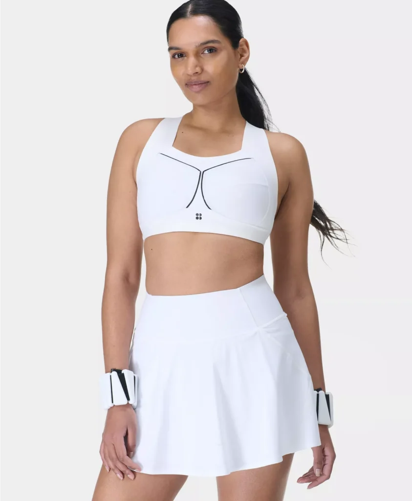 woman in sweaty betty skirt and sports bra