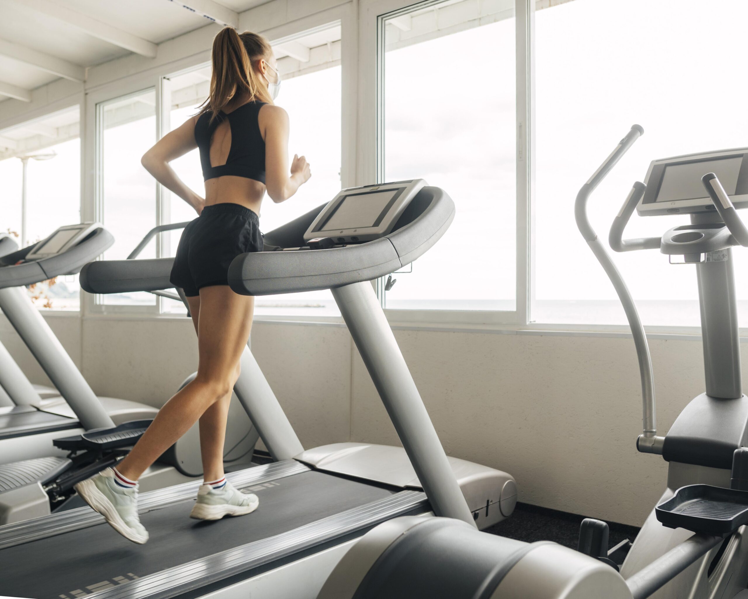 Woman runs on a treadmill