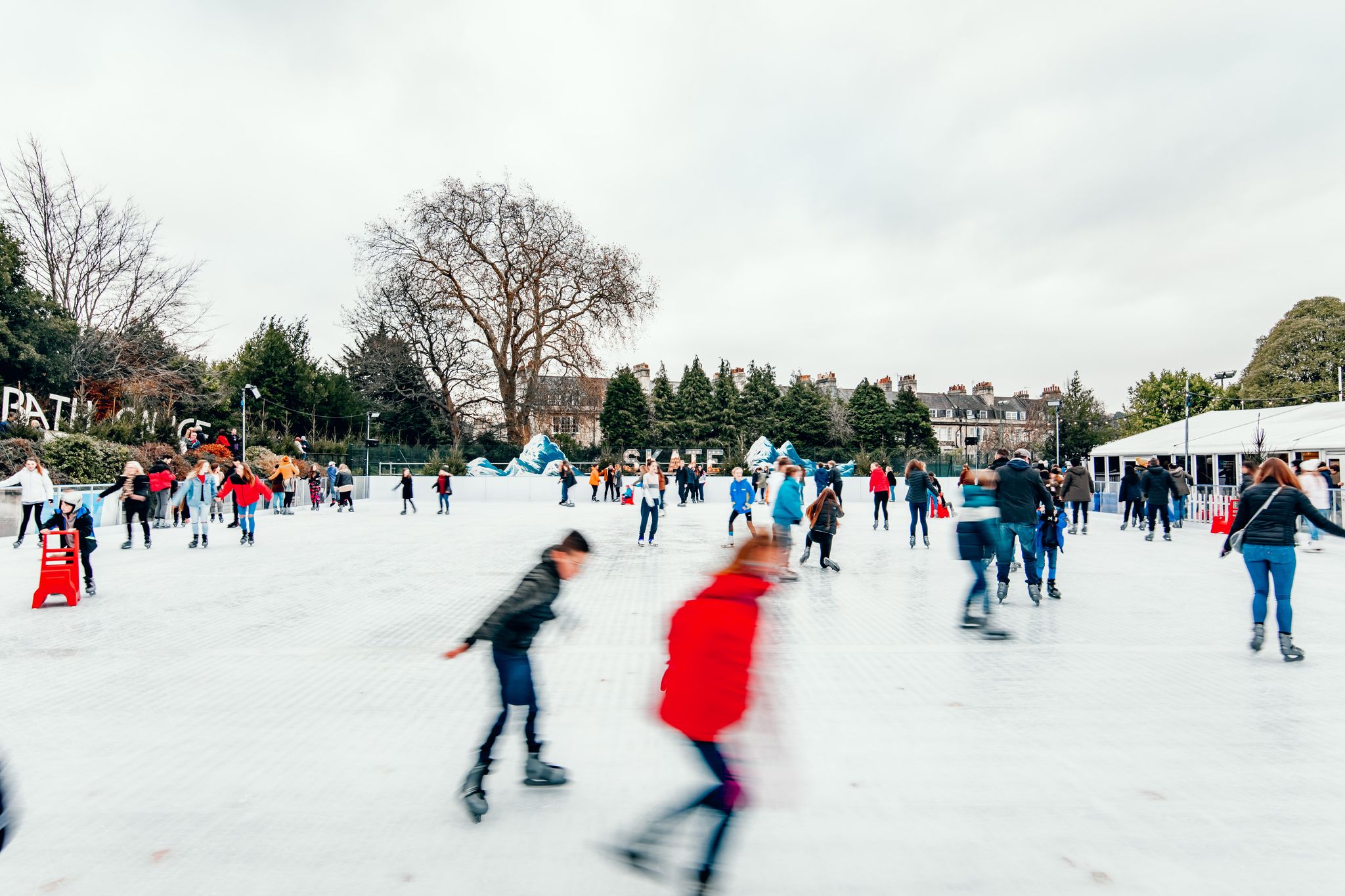 people skating around the skate rink at bath on ice