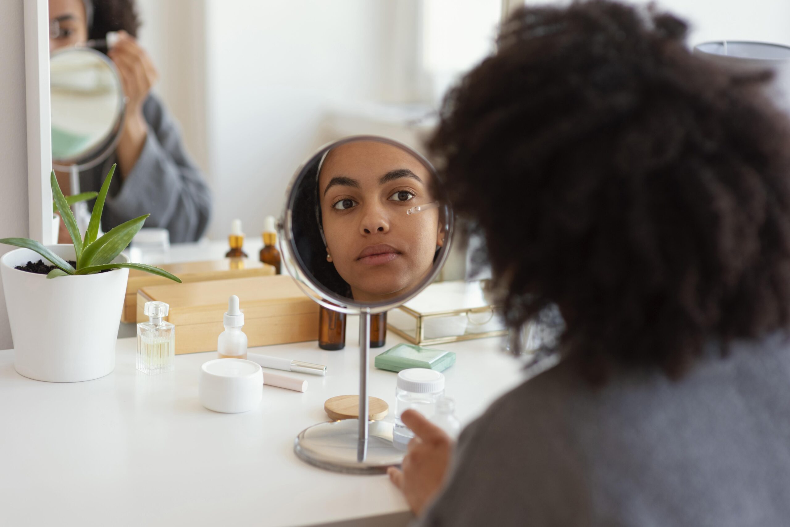 Woman using eye cream