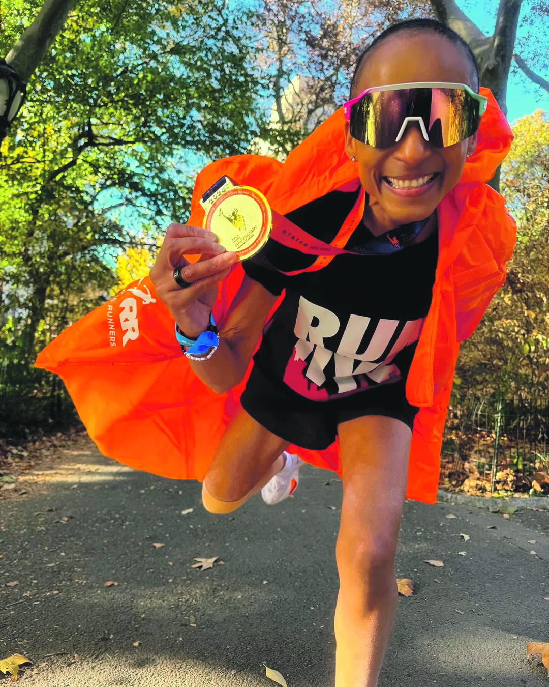 Adele Roberts holding a medal