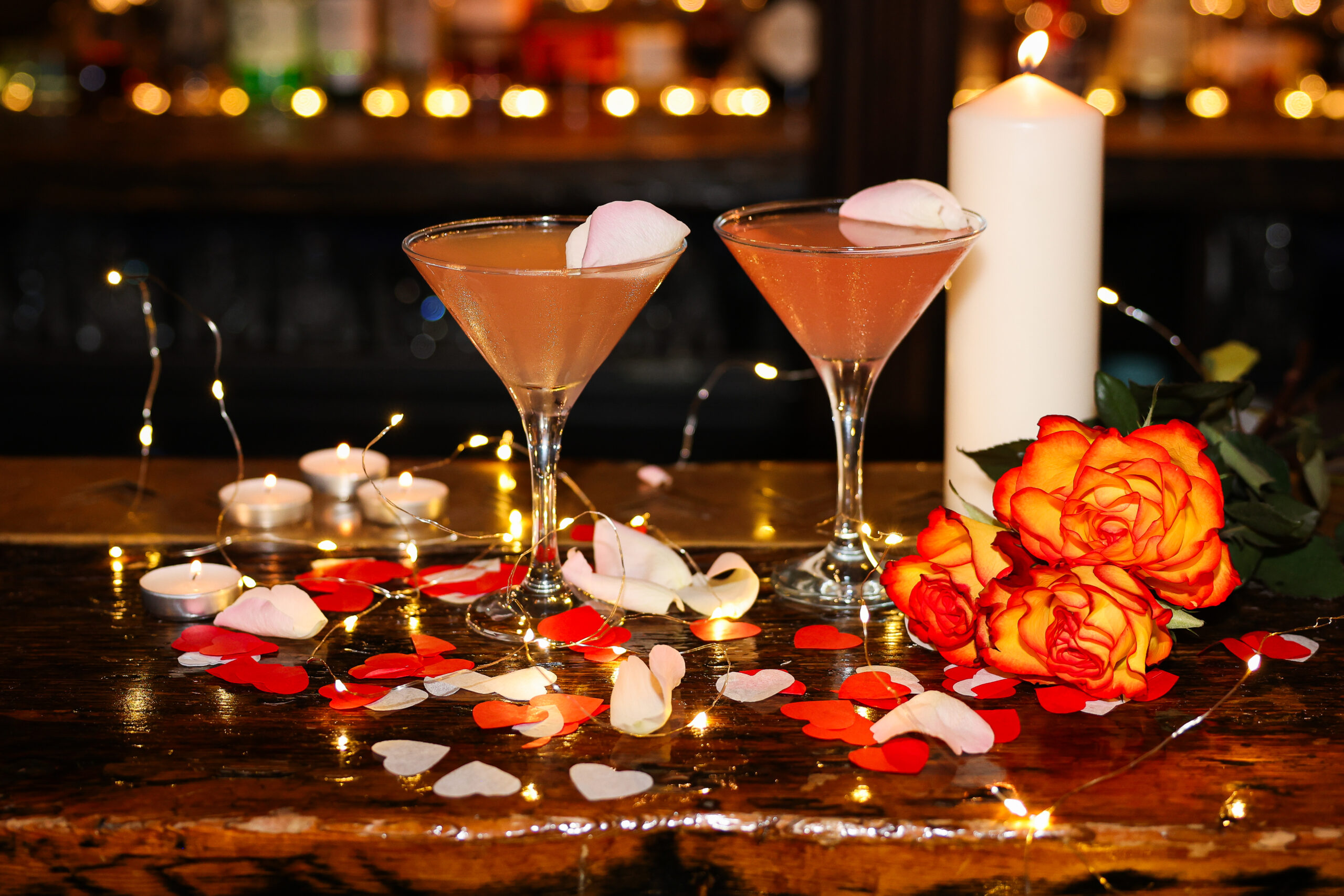 Lucky Pig cocktail party with cocktails petals flowers and candle