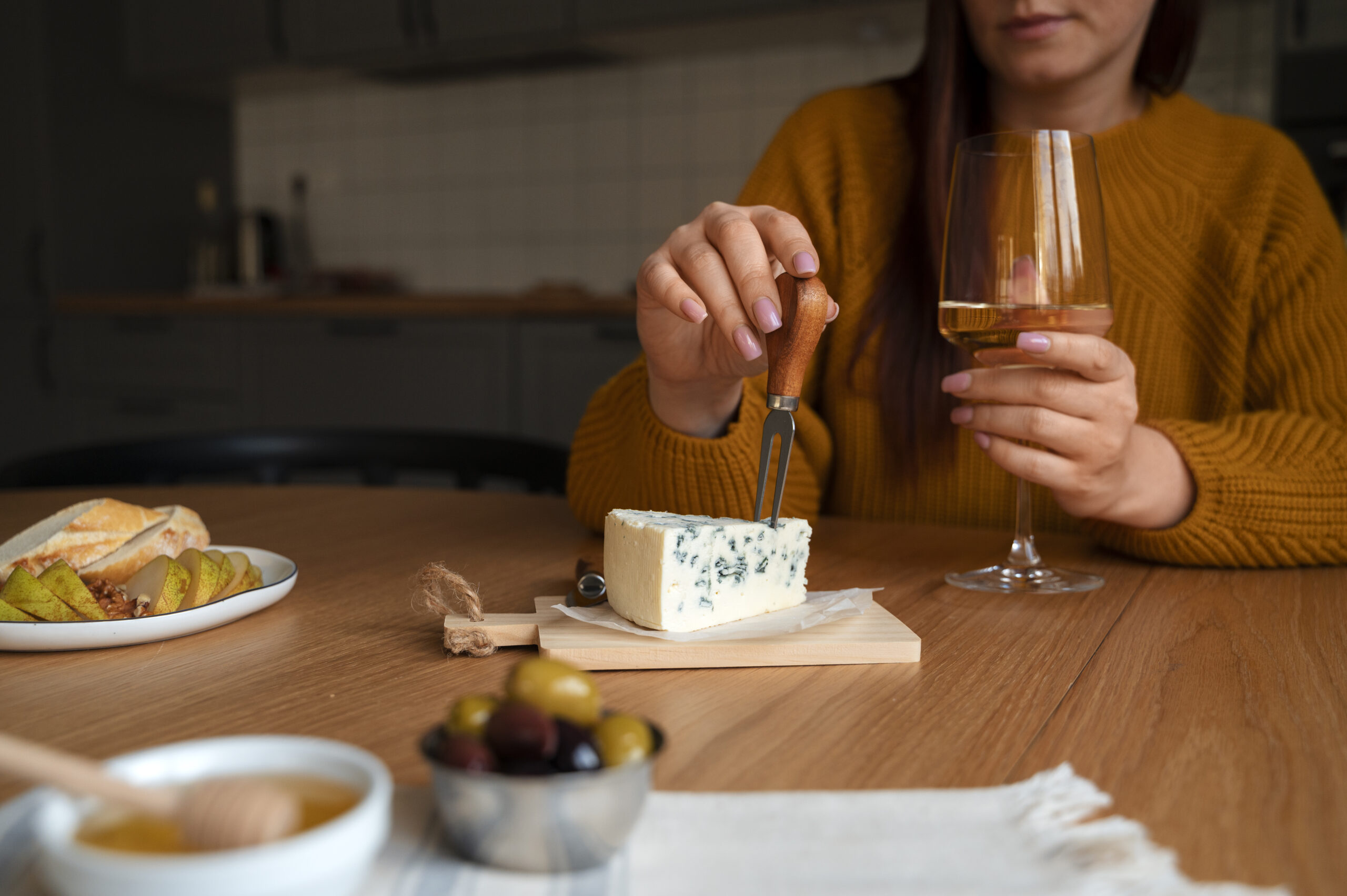 Woman eating blue cheese