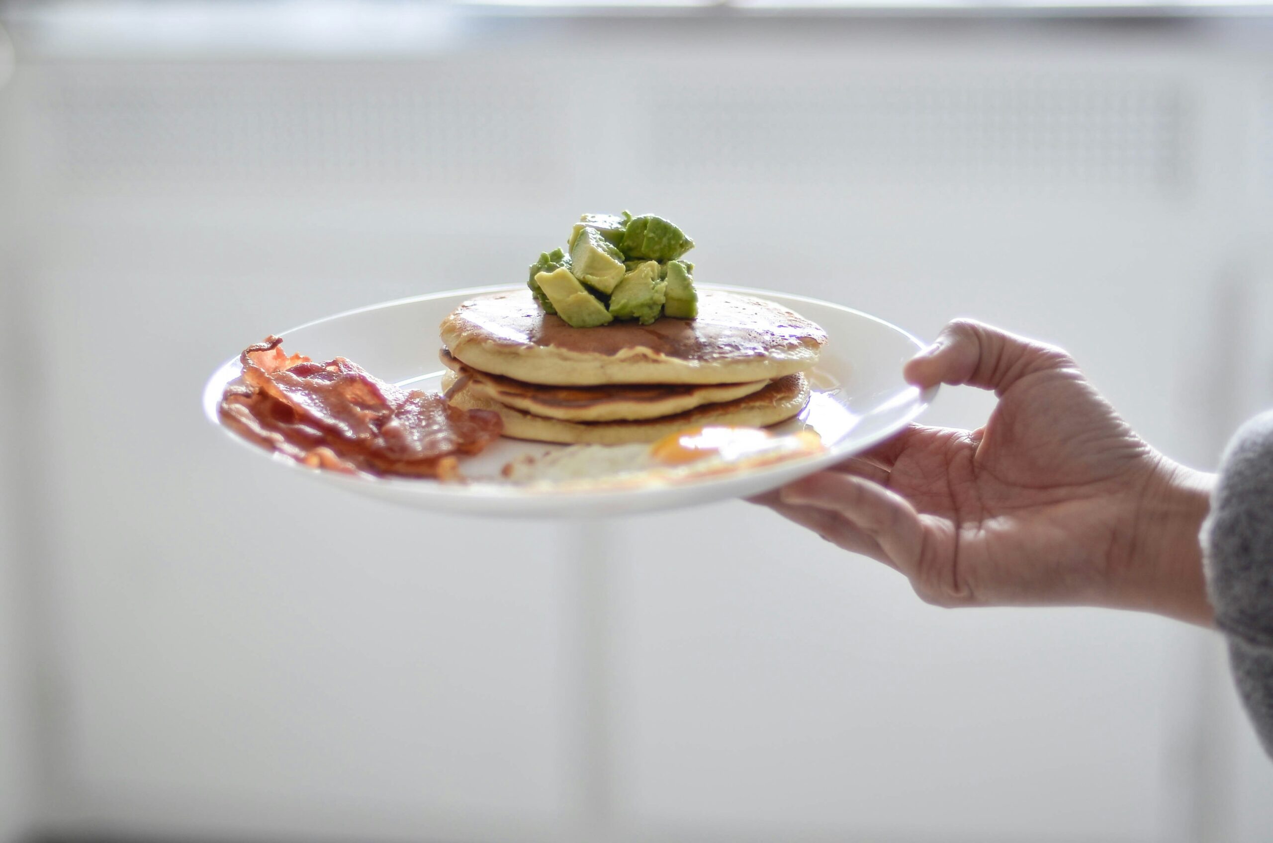 Pancakes with avocado and bacon