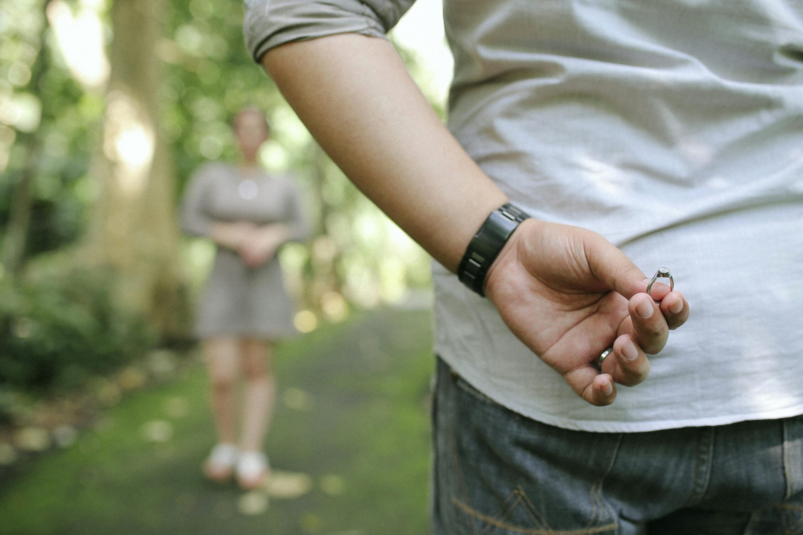 Man holds an engagement ring