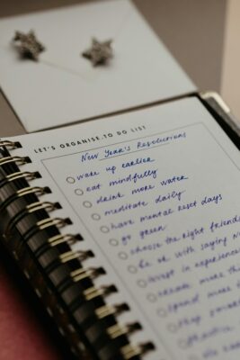A ring-binder notebook with new years resolutions listed out