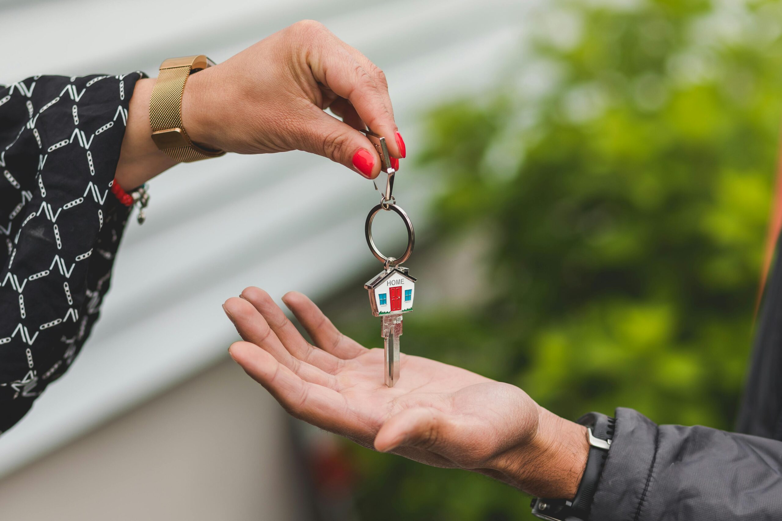 Estate agent hands over a house key