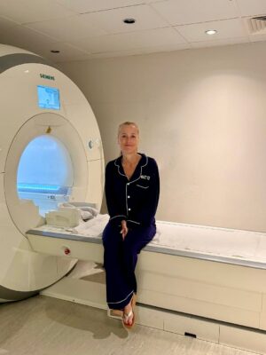 Gillian Anderson sits in an Ezra MRI