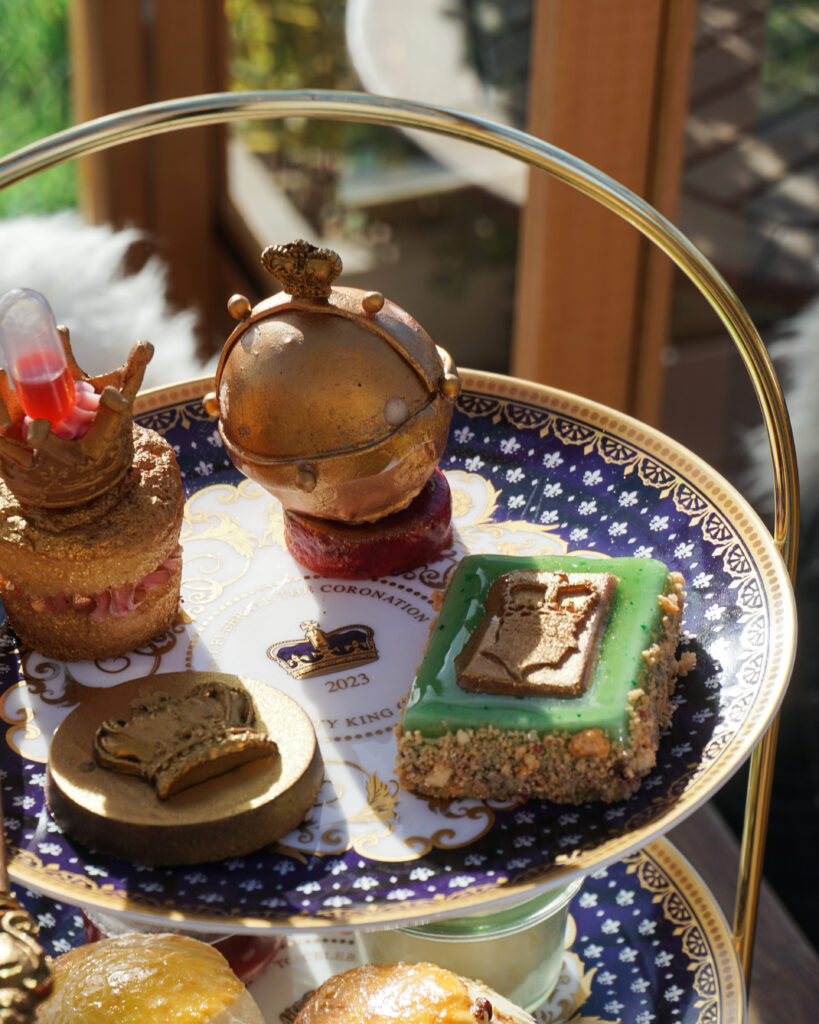 close up royal cake biscuits on royal tiered stand