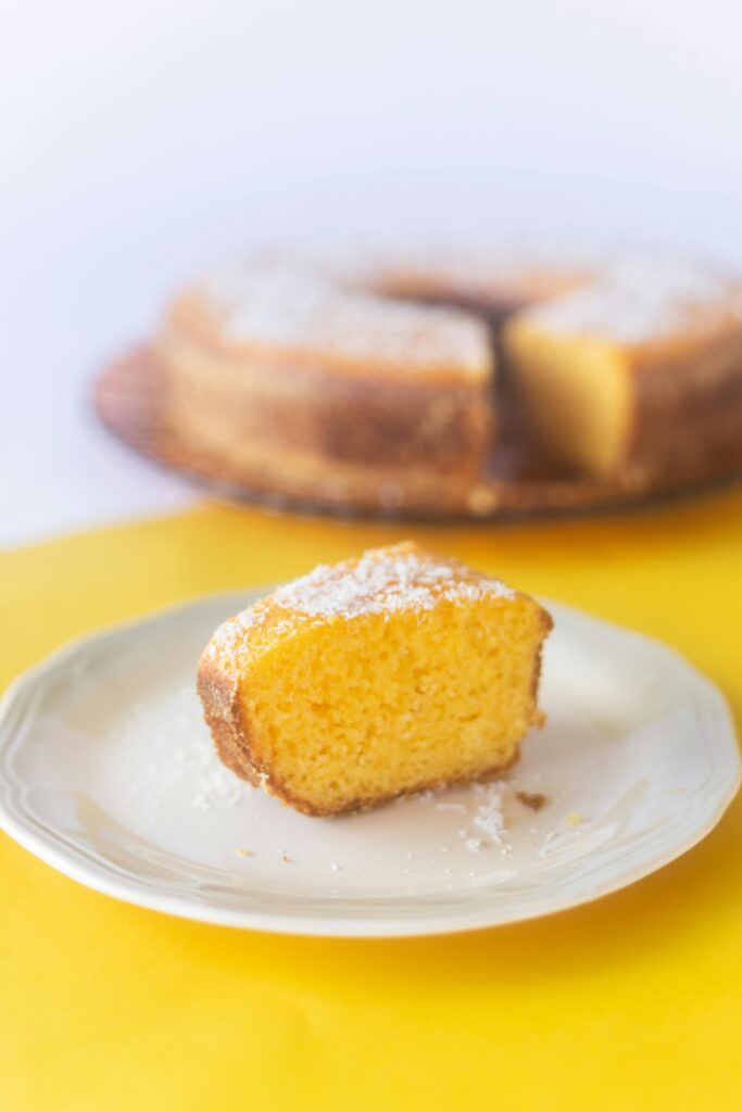 cake slice on plate on yellow table