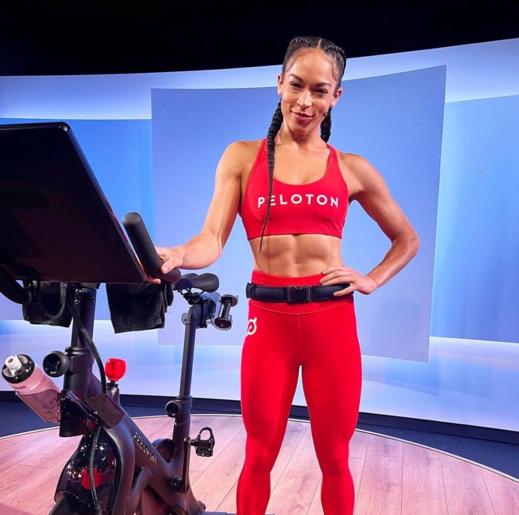Hannah Frankson poses with a Peloton