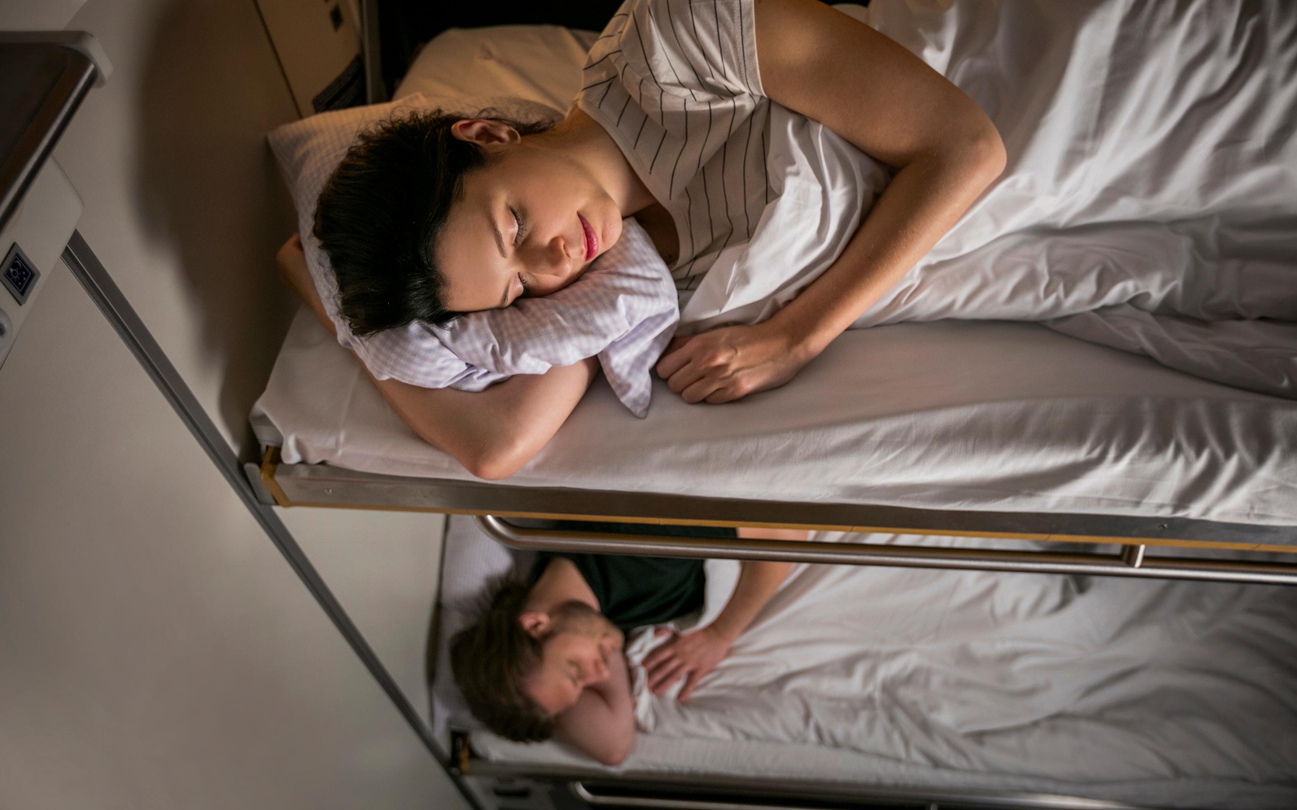 Couple asleep in their couchette