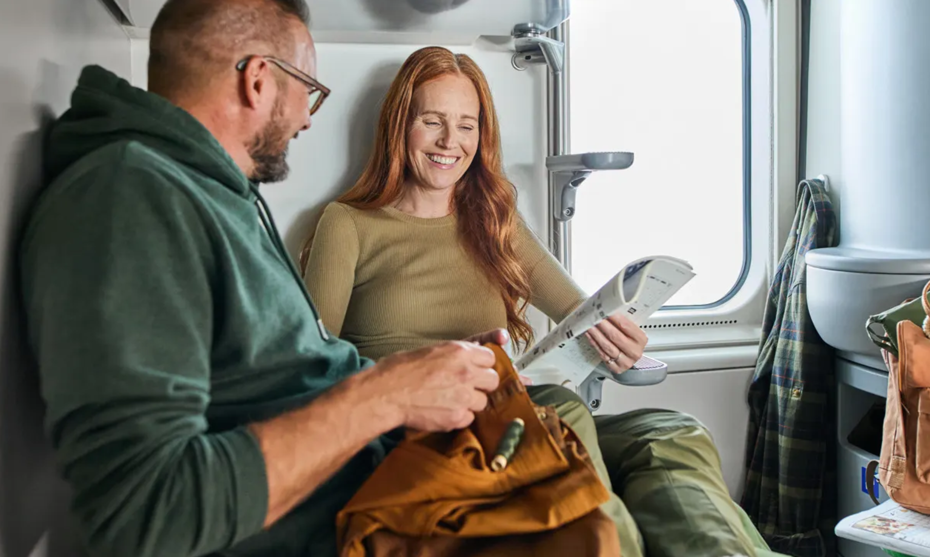Couple relaxing on their sleeper train