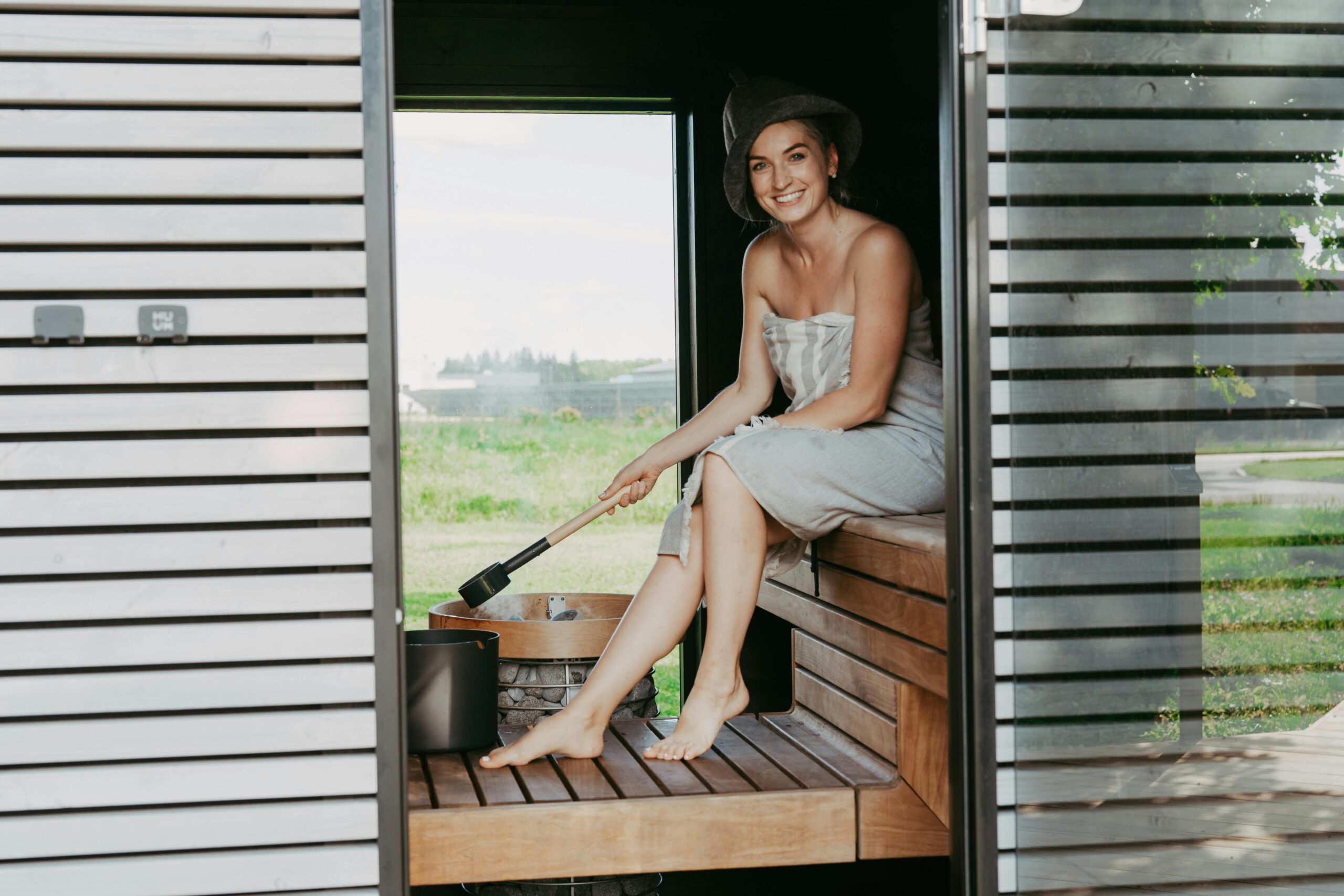 Woman smiles in a sauna