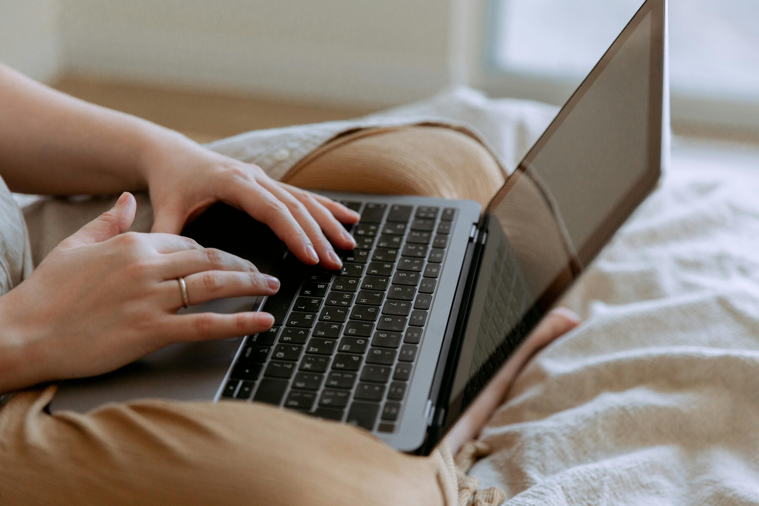 woman sitting cross legged on laptop 
