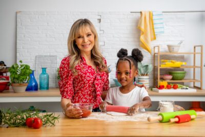 Annabel Karmel in red top with a child