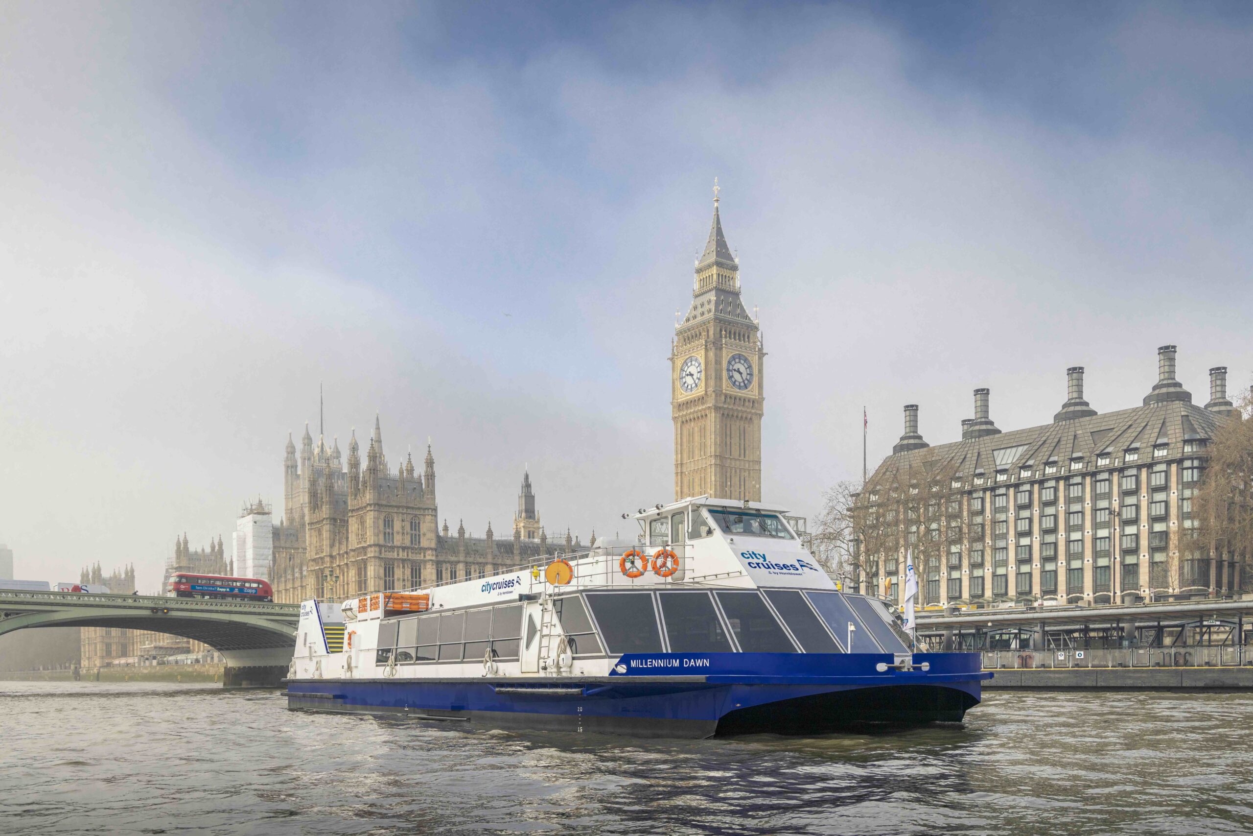 Shot of the River Thames with a City Sightseeing Cruise Ship sailing past