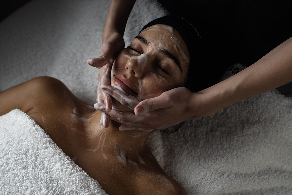 Woman getting a facial at Grown Alchemist 