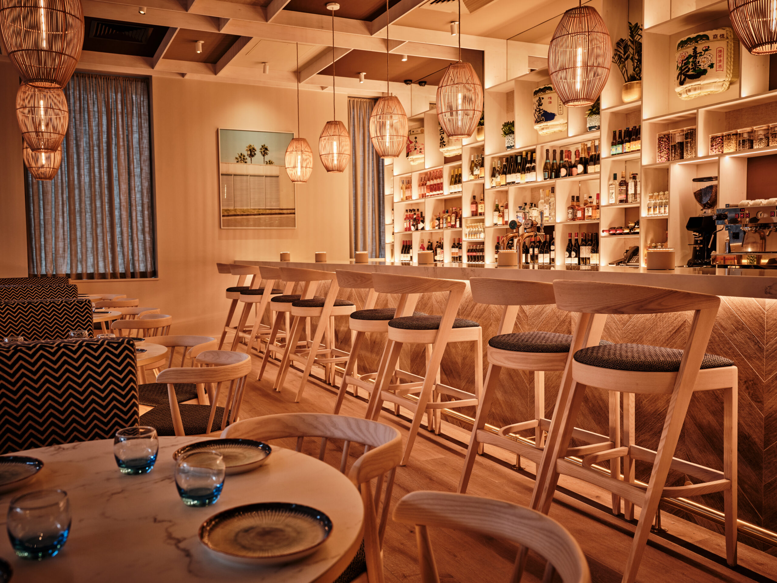 interior of HUO restaurant with wooden floor tables and bar