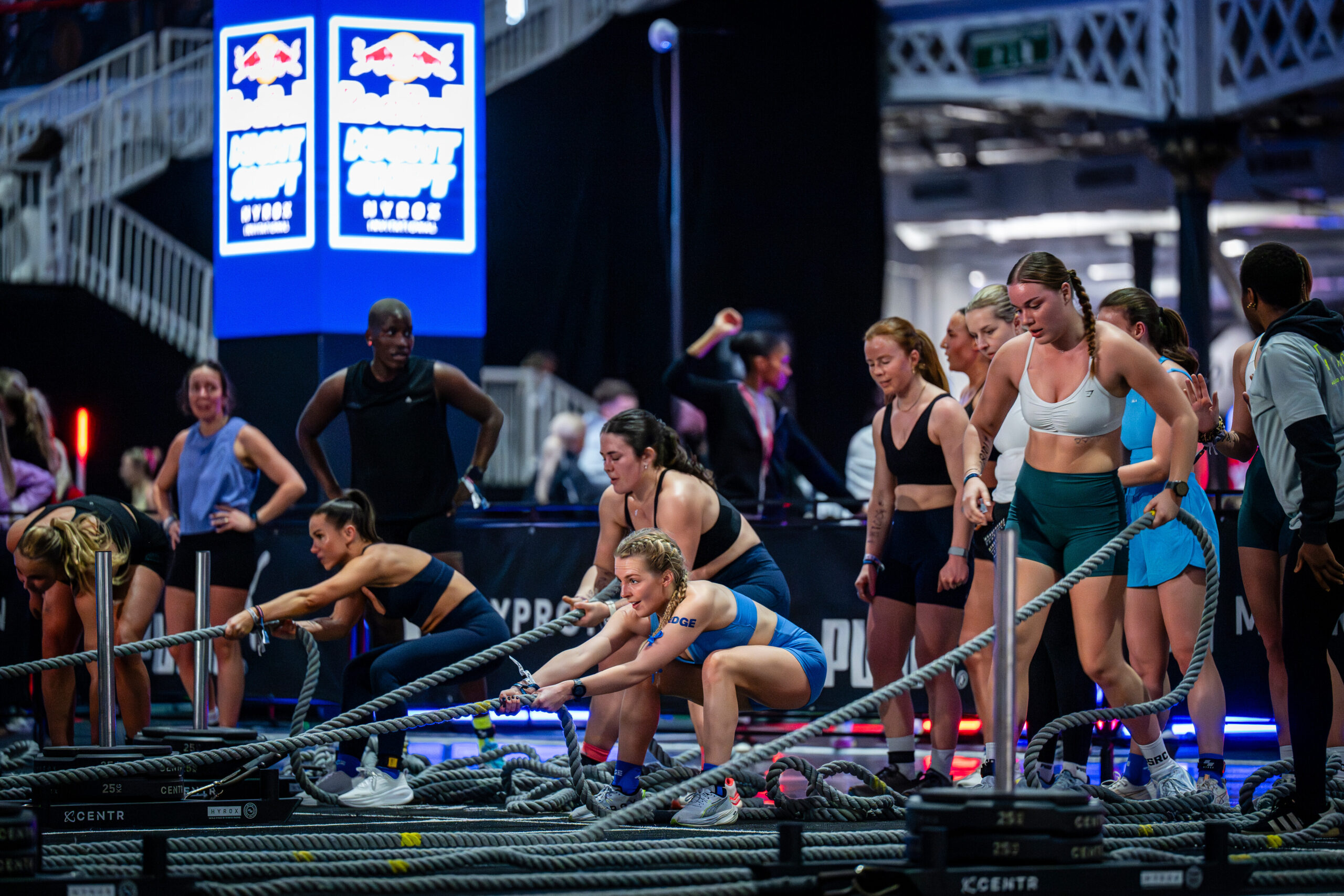 Participants compete on the sled pull at Red Bull Night Shift Olympia in London