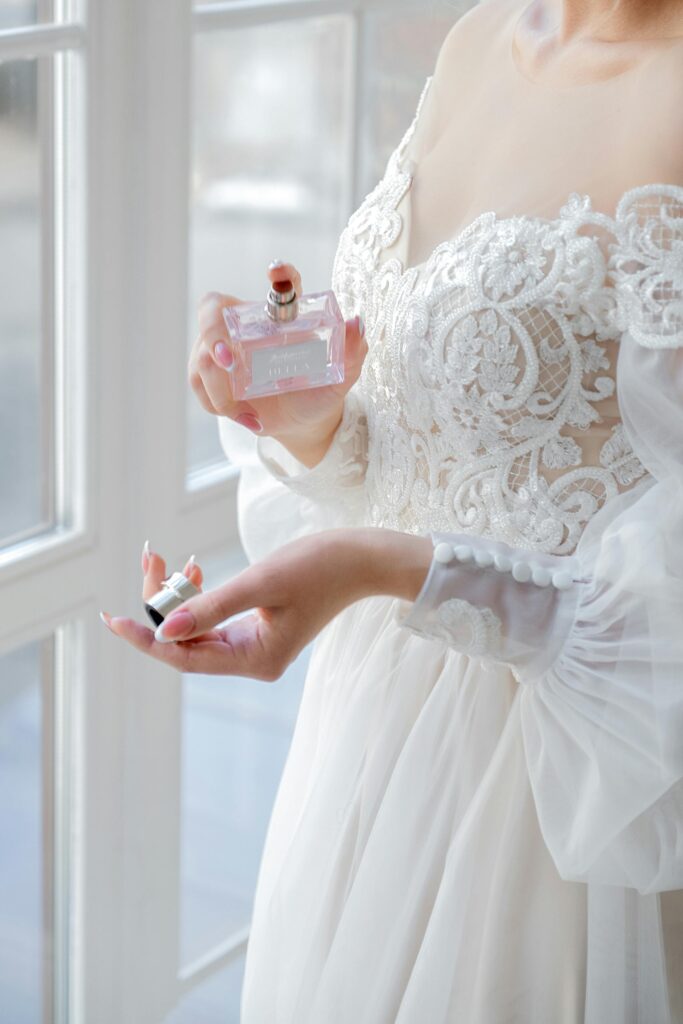 Bride spraying perfume