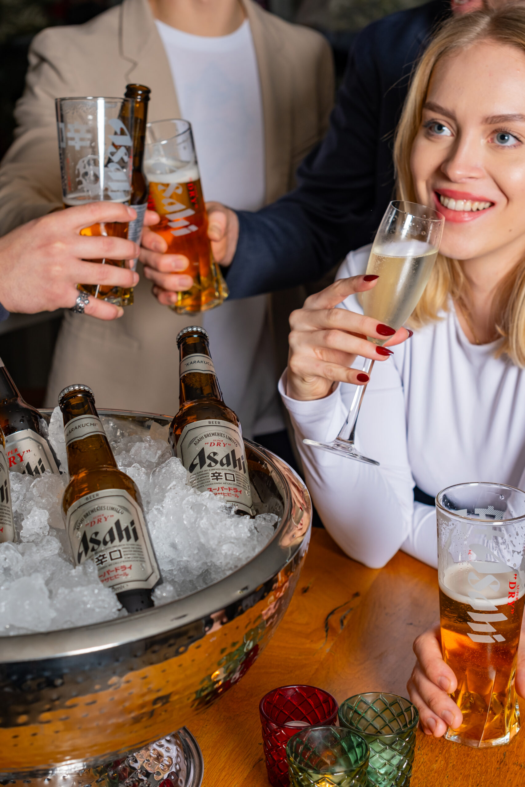 People sipping Asahi and prosecco
