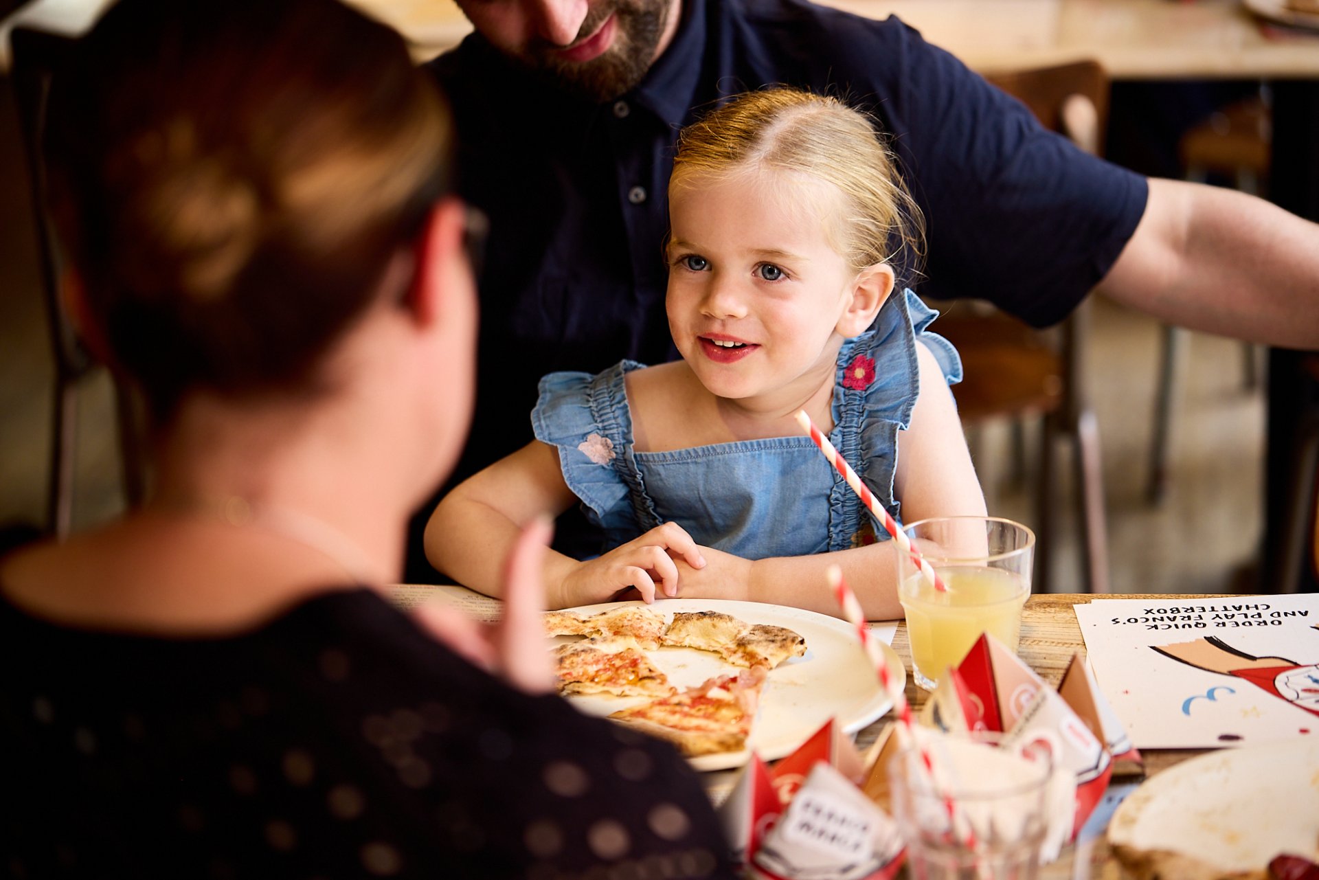 Child eats pizza at Franco Manca