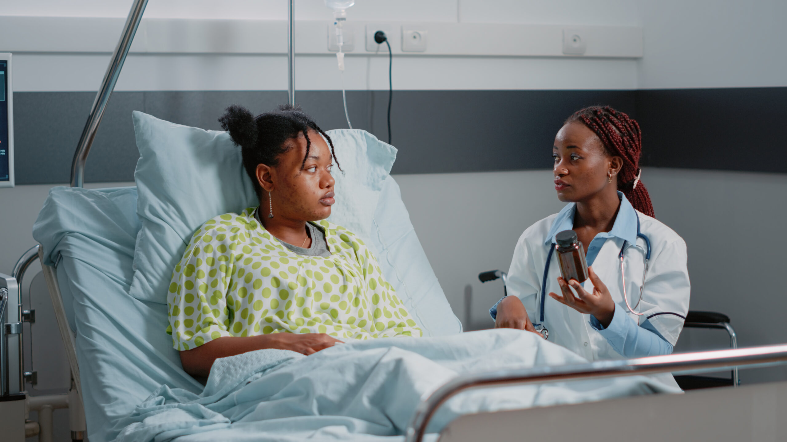 Female patient in discussion with doctor