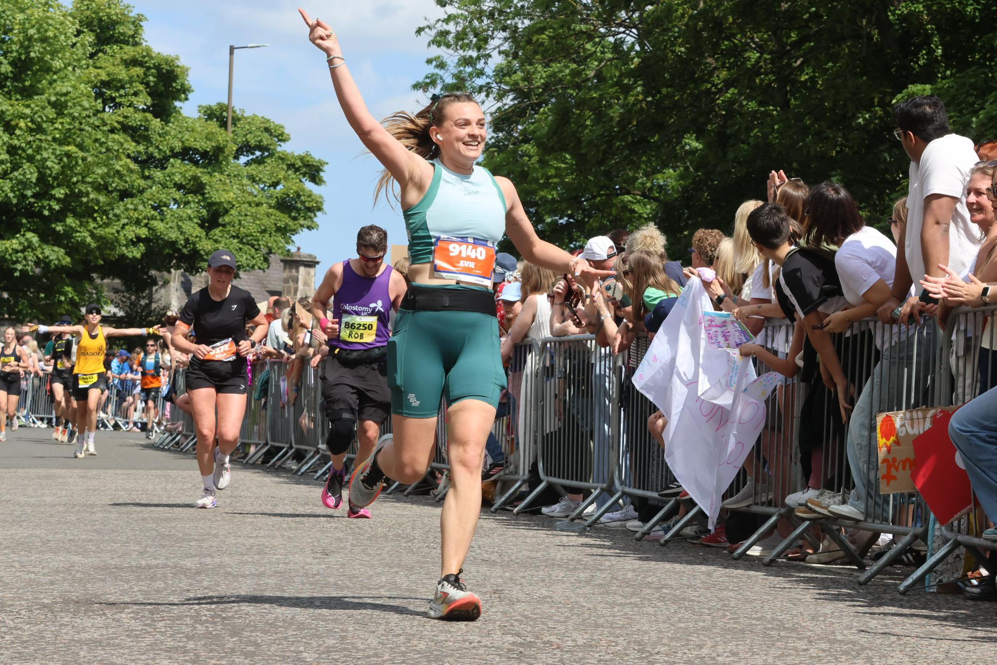 Evelyn Richards celebrates as she runs the Edinburgh Marathon