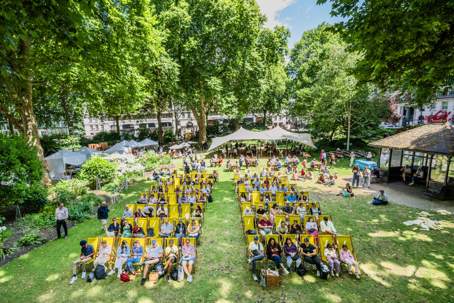 Big screen and deck chairs in Portman Square Garden