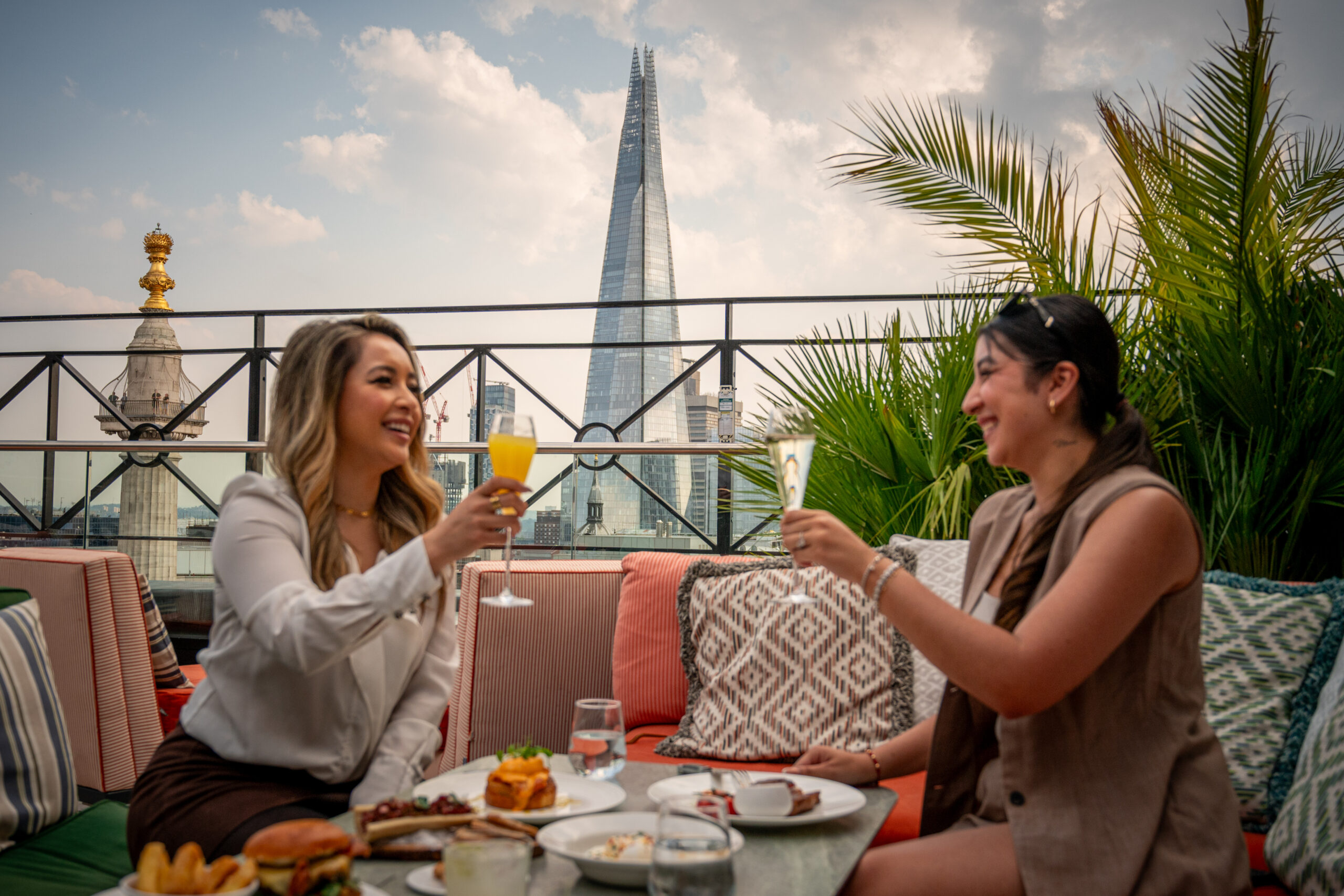 Two women having brunch on the rooftop terrace of Wagtail with a view of The Shard