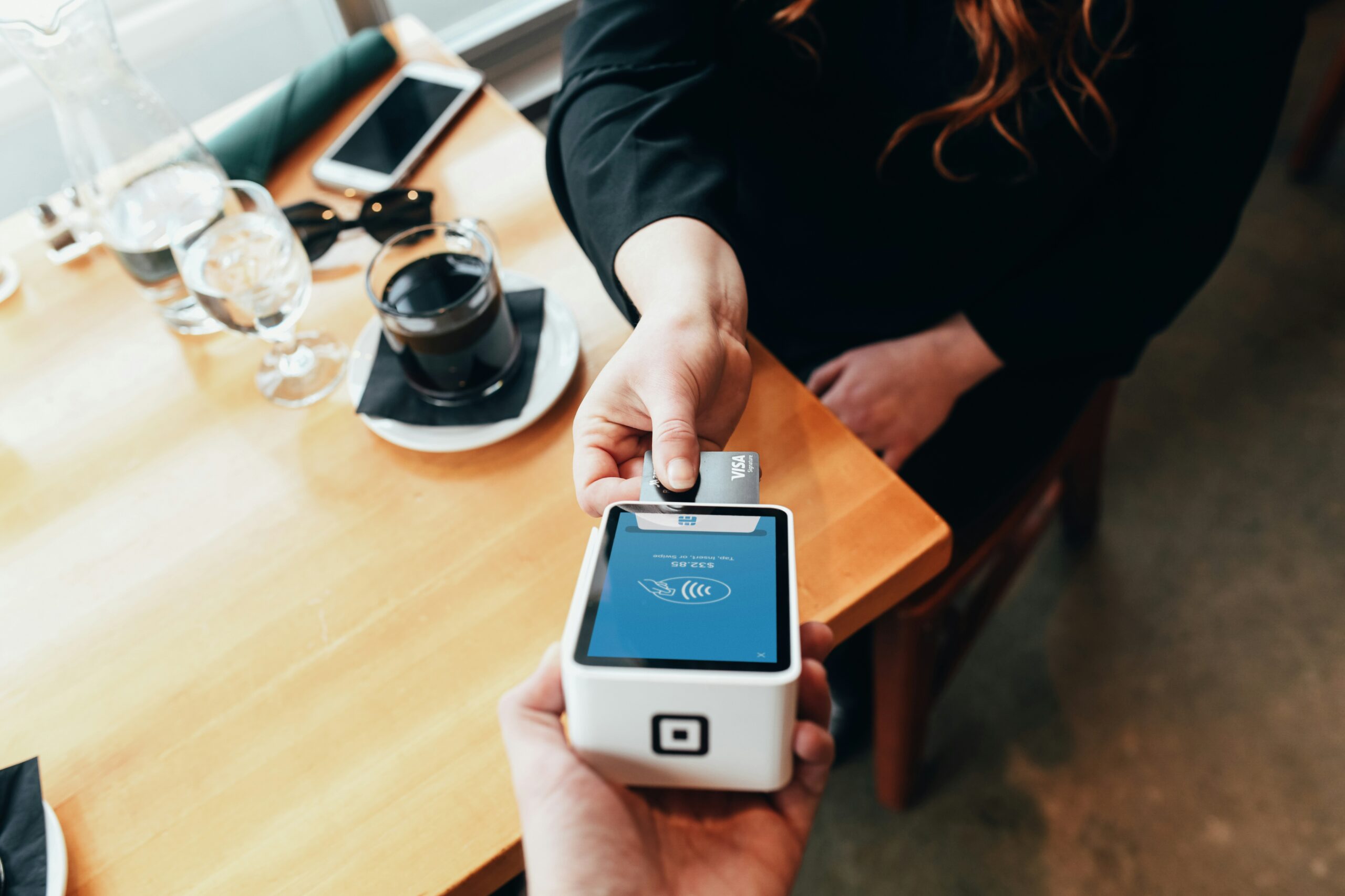 Woman pays with a bank card