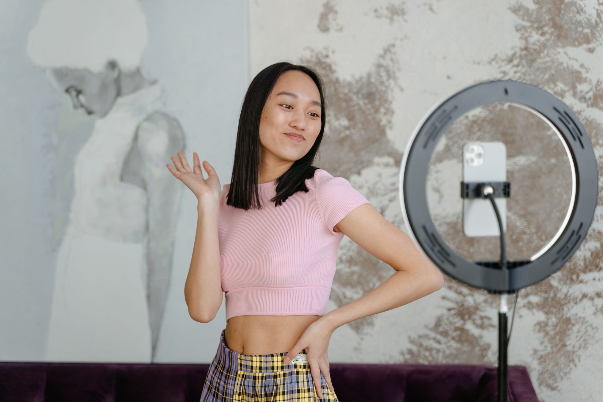Teen girl films a social media video
