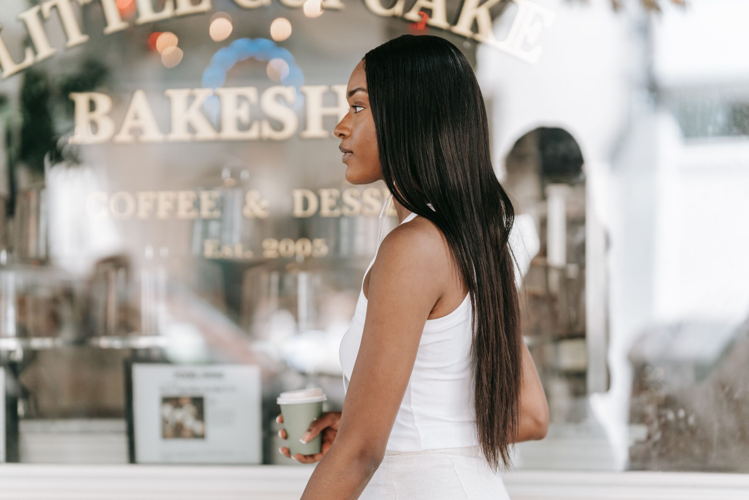 Woman walking with a coffee