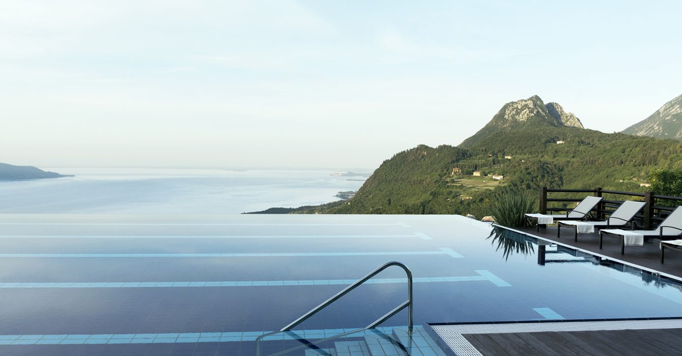 The breathtaking view of an infinity pool overlooking the sea.