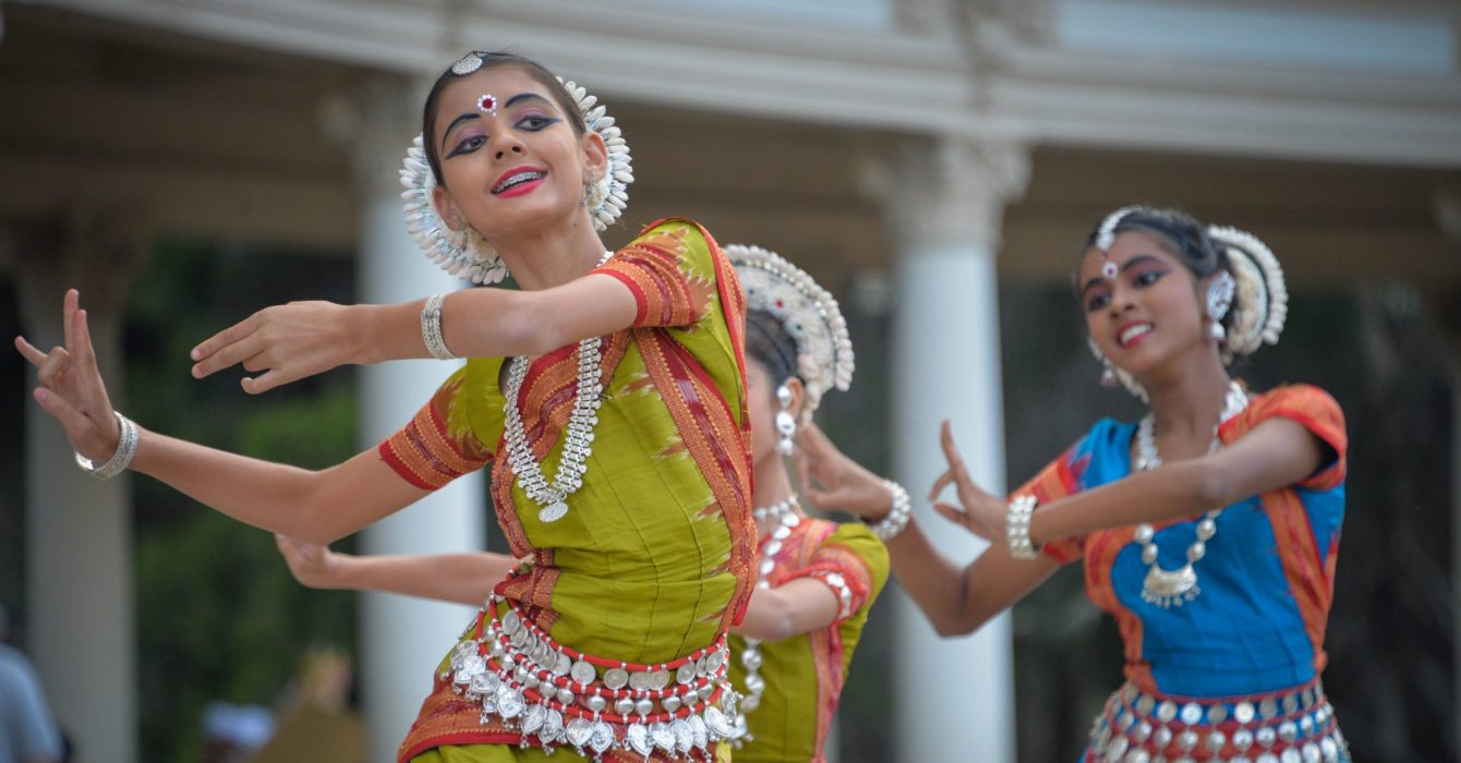 Young Bollywood dancers dancing in their costumes