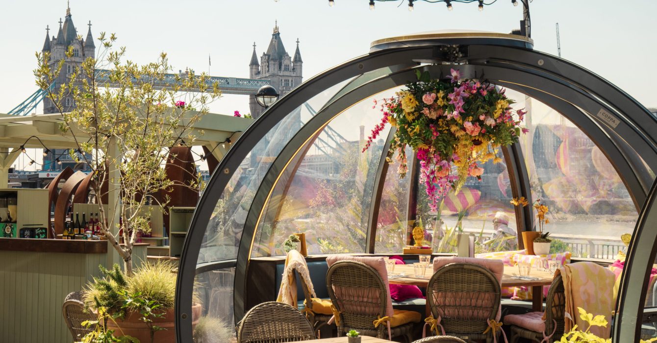 The outdoor igloos at Coppa Club with Tower Bridge behind