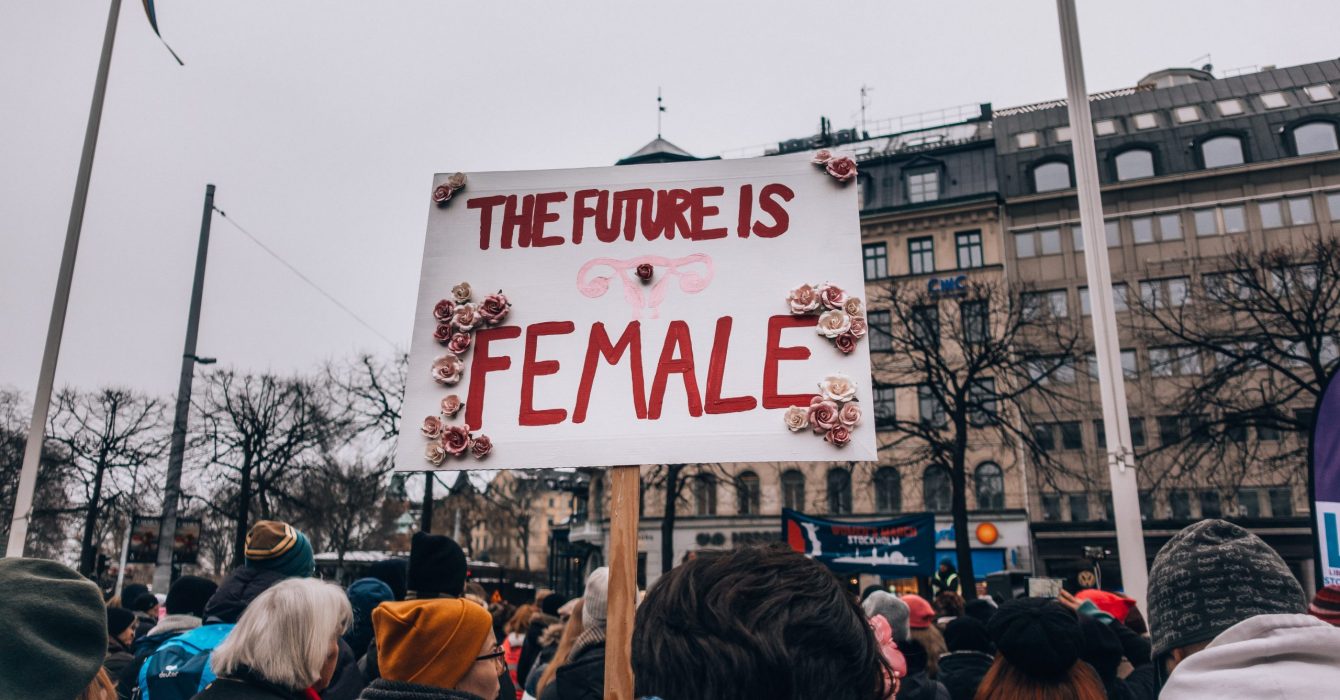 A crowd protesting equal rights for women.