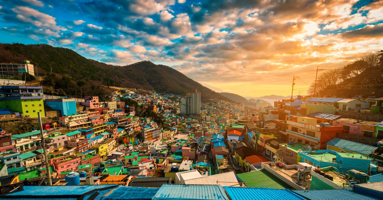 The sun setting on the colourful, mountain-set houses in Gamcheon Cultural Village, Busan, South Korea.