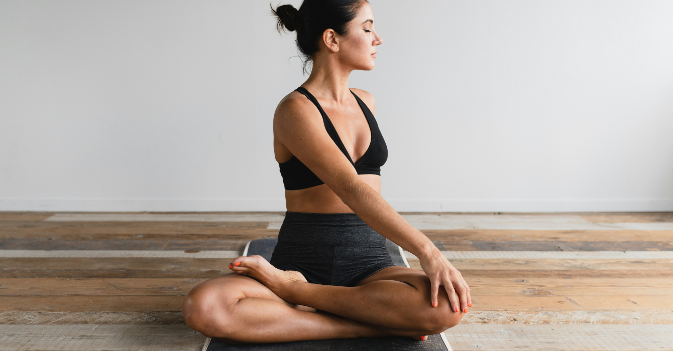 woman doing yoga at home