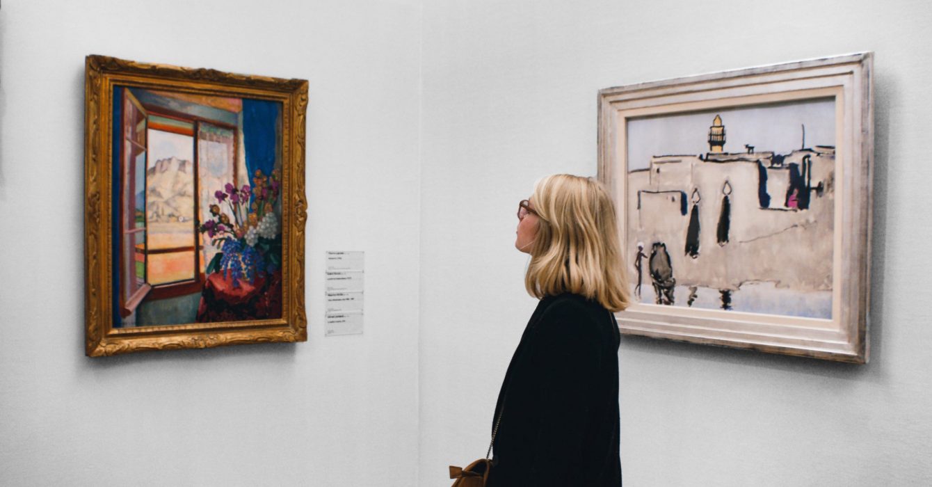 A young teenager enjoying a trip to a gallery.