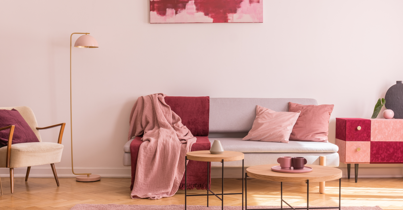 Inviting living room featuring a sofa adorned with a Viva magenta throw.