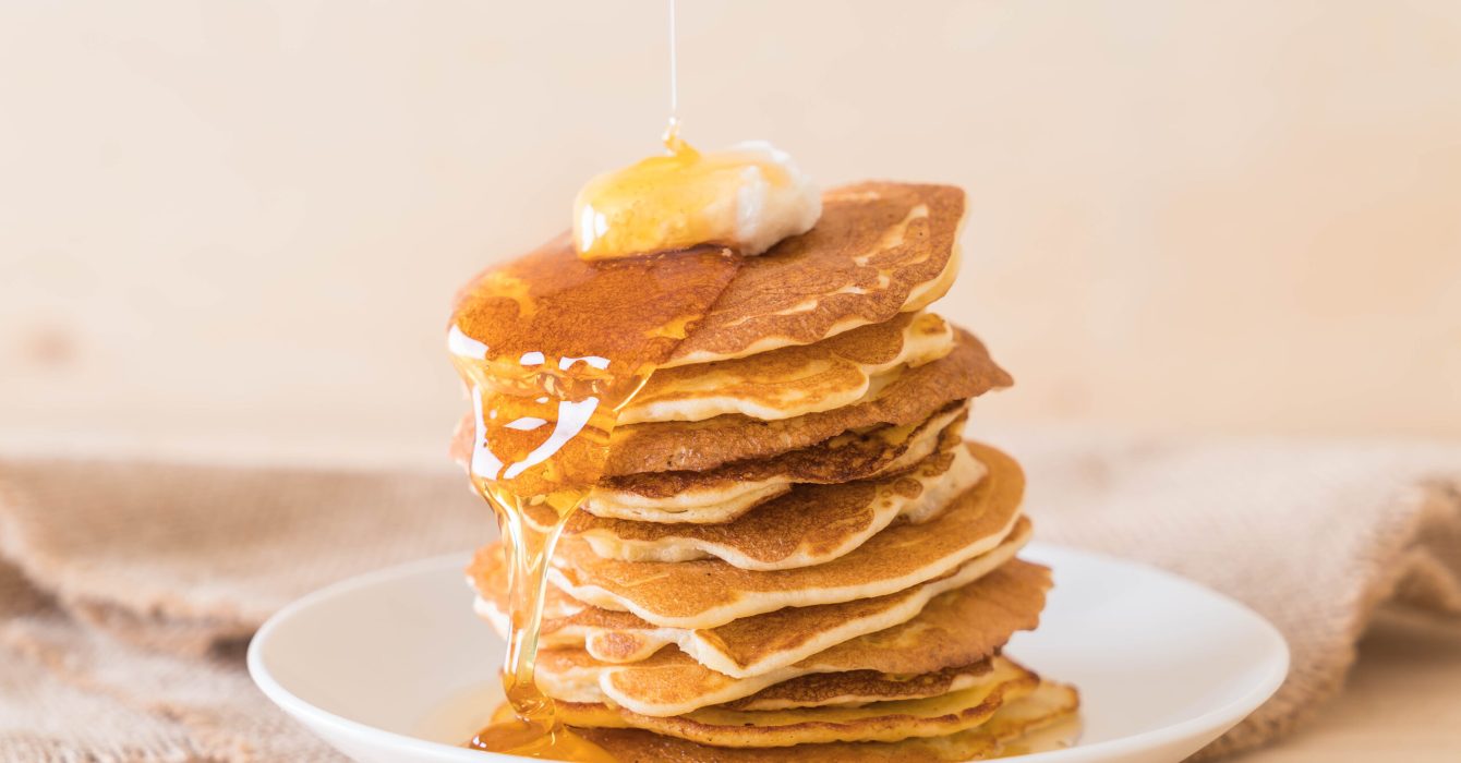 cheese on pancake stack with honey