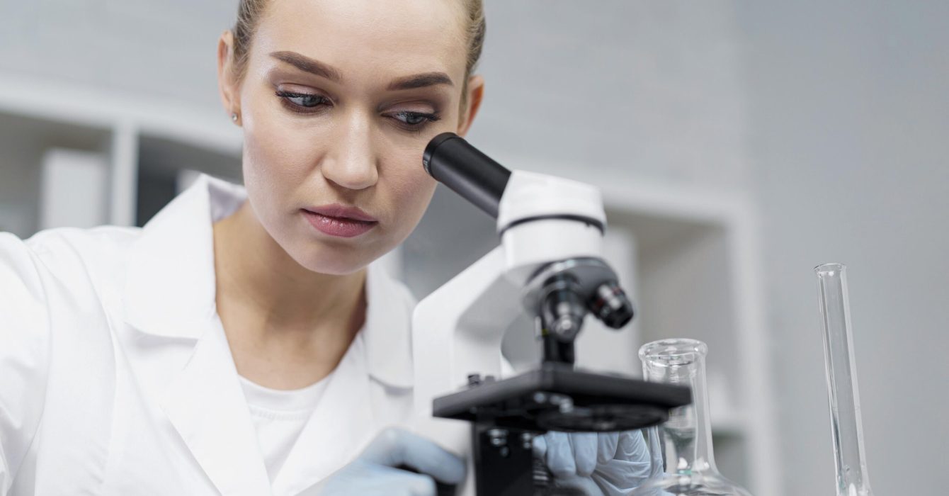 female-researcher-laboratory-with-microscope