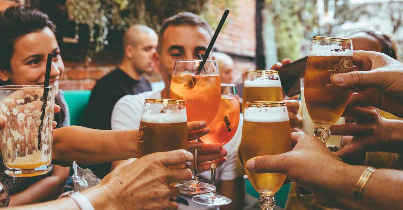 people holding drinks